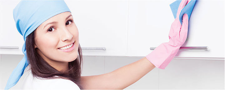 photo of cleaner wiping a kitchen